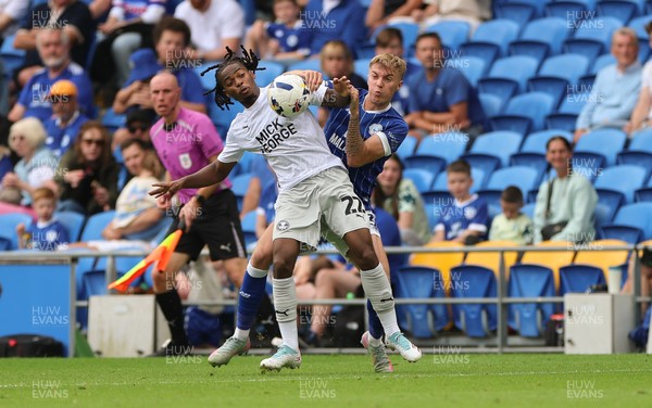 020825 - Cardiff City v Peterborough United, EFL Sky Bet League 1 - Donay O'Brien-Brady of Peterborough United and Joel Bagan of Cardiff City compete for the ball
