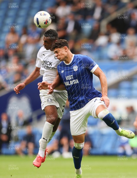 020825 - Cardiff City v Peterborough United, EFL Sky Bet League 1 - Yousef Salech of Cardiff City and David Okagbue of Peterborough United compete for the ball