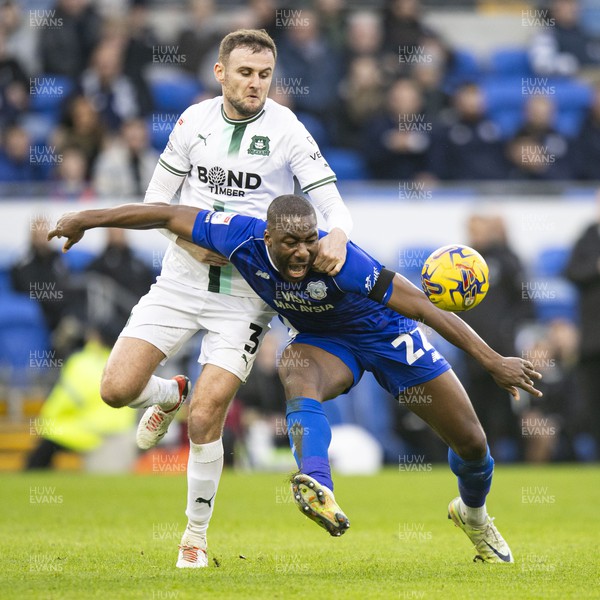 261223 - Cardiff City v Plymouth Argyle - Sky Bet Championship - Yakou Meite of Cardiff City in action against Macaulay Gillesphey of Plymouth Argyle