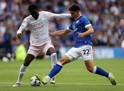 300825 - Cardiff City v Plymouth Argyle, SkyBet League One - Yousef Salech of Cardiff City is challenged by Brendan Wiredu of Plymouth Argyle 