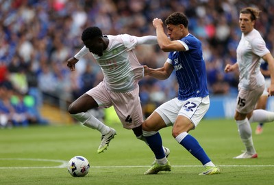 300825 - Cardiff City v Plymouth Argyle, SkyBet League One - Yousef Salech of Cardiff City is challenged by Brendan Wiredu of Plymouth Argyle 