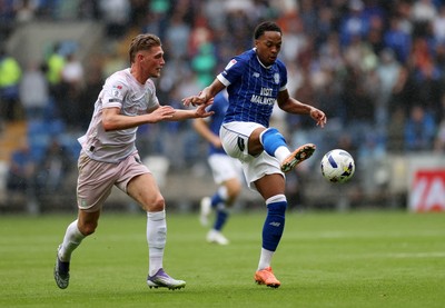 300825 - Cardiff City v Plymouth Argyle, SkyBet League One - Chris Willock of Cardiff City is challenged by Kornel Szucs of Plymouth Argyle 