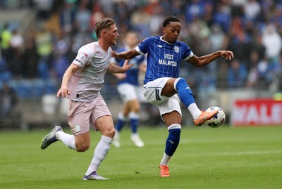 300825 - Cardiff City v Plymouth Argyle, SkyBet League One - Chris Willock of Cardiff City is challenged by Kornel Szucs of Plymouth Argyle 