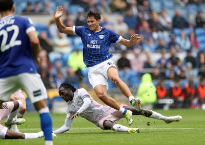 300825 - Cardiff City v Plymouth Argyle, SkyBet League One - Rubin Colwill of Cardiff City is tackled by Malachi Boateng of Plymouth Argyle 
