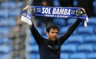 300825 - Cardiff City v Plymouth Argyle, SkyBet League One - Cardiff City Manager Brian Barry-Murphy holds up a Sol Bamba scarf at full time