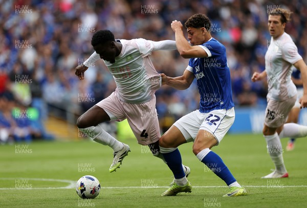 300825 - Cardiff City v Plymouth Argyle, SkyBet League One - Yousef Salech of Cardiff City is challenged by Brendan Wiredu of Plymouth Argyle 