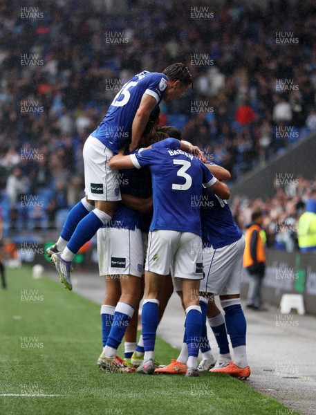 300825 - Cardiff City v Plymouth Argyle, SkyBet League One - Chris Willock of Cardiff City celebrates scoring a goal with team mates