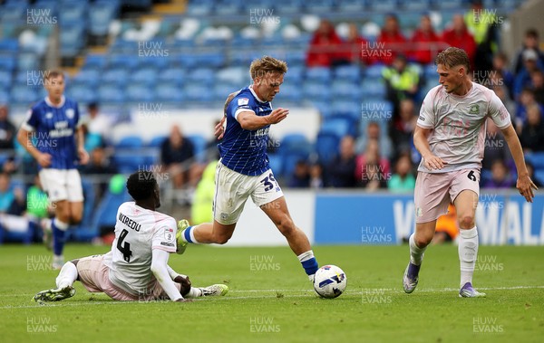 300825 - Cardiff City v Plymouth Argyle, SkyBet League One - Isaak Davies of Cardiff City is challenged by Brendan Wiredu of Plymouth Argyle 