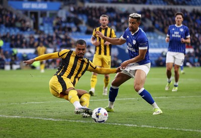 220426 - Cardiff City v Port Vale FC - SkyBet League One - Cameron Humphreys of Port Vale is challenged by Callum Robinson of Cardiff City 