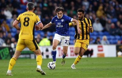 220426 - Cardiff City v Port Vale FC - SkyBet League One - Joel Colwill of Cardiff City is challenged by George Hall of Port Vale 