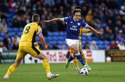 220426 - Cardiff City v Port Vale FC - SkyBet League One - Joel Colwill of Cardiff City is challenged by George Hall of Port Vale 