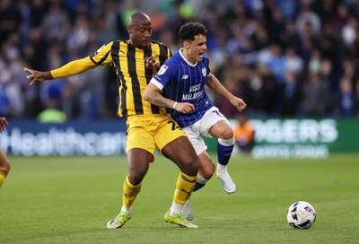 220426 - Cardiff City v Port Vale FC - SkyBet League One - Alex Robertson of Cardiff City is tackled by Martin Sherif of Port Vale 