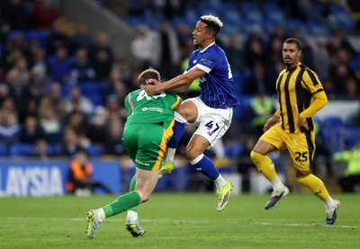 220426 - Cardiff City v Port Vale FC - SkyBet League One - Callum Robinson of Cardiff City collides with Joe Gauci of Port Vale 