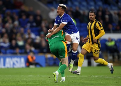 220426 - Cardiff City v Port Vale FC - SkyBet League One - Callum Robinson of Cardiff City collides with Joe Gauci of Port Vale 