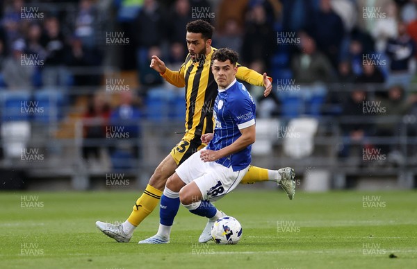 220426 - Cardiff City v Port Vale FC - SkyBet League One - Alex Robertson of Cardiff City is challenged by George Hall of Port Vale 