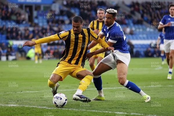 220426 - Cardiff City v Port Vale FC - SkyBet League One - Cameron Humphreys of Port Vale is challenged by Callum Robinson of Cardiff City 