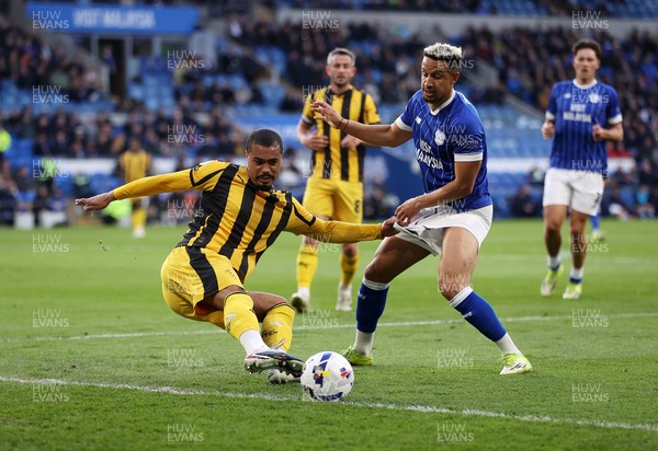 220426 - Cardiff City v Port Vale FC - SkyBet League One - Cameron Humphreys of Port Vale is challenged by Callum Robinson of Cardiff City 