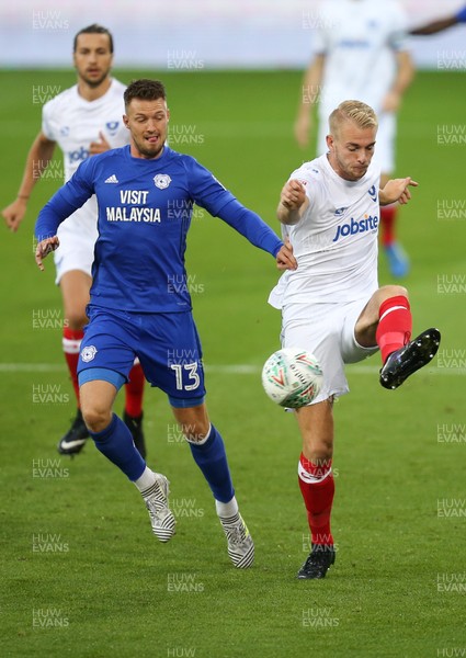 080817 - Cardiff City v Portsmouth, Carabao Cup, Round 1 - Anthony Pilkington of Cardiff City and Jack Whatmough of Portsmouth compete for the ball
