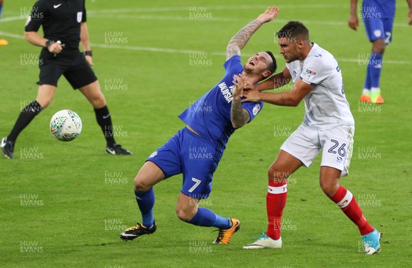 080817 - Cardiff City v Portsmouth, Carabao Cup, Round 1 - Lee Tomlin of Cardiff City and Gareth Evans of Portsmouth tangle as they look to win the ball