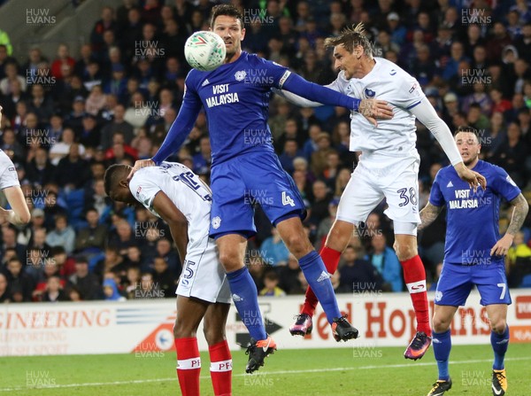 080817 - Cardiff City v Portsmouth, Carabao Cup, Round 1 - Sean Morrison of Cardiff City challenges Nicke Kabamba of Portsmouth and Brandon Haunstrup of Portsmouth for the ball