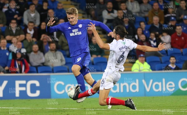 080817 - Cardiff City v Portsmouth, Carabao Cup, Round 1 - Danny Ward of Cardiff City is challenged by Christian Burgess of Portsmouth