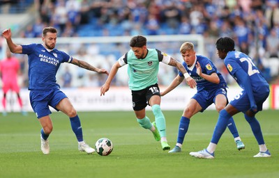 090822 - Cardiff City v Portsmouth, EFL Carabao Cup - Owen Dale of Portsmouth takes on Joe Ralls, Joel Bagan and Jaden Philogene of Cardiff City