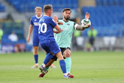 090822 - Cardiff City v Portsmouth, EFL Carabao Cup - Gavin Whyte of Cardiff City challenges Marlon Pack of Portsmouth