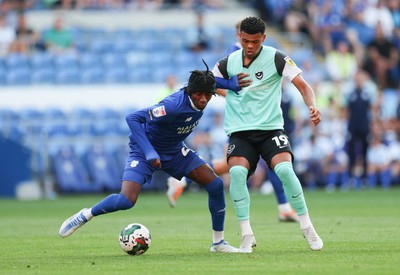 090822 - Cardiff City v Portsmouth, EFL Carabao Cup - Jaden Philogene of Cardiff City holds off Dane Scarlett of Portsmouth