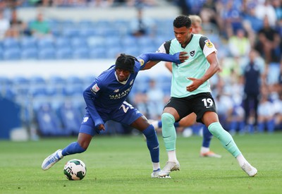 090822 - Cardiff City v Portsmouth, EFL Carabao Cup - Jaden Philogene of Cardiff City holds off Dane Scarlett of Portsmouth