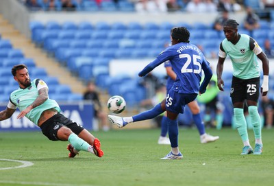 090822 - Cardiff City v Portsmouth, EFL Carabao Cup - Marlon Pack of Portsmouth dives in to block a shot by Jaden Philogene of Cardiff City