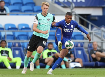 090822 - Cardiff City v Portsmouth, EFL Carabao Cup - Vontae Campbell of Cardiff City controls the ball as Joe Pigott of Portsmouth closes in