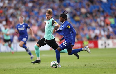 090822 - Cardiff City v Portsmouth, EFL Carabao Cup - Jaden Philogene of Cardiff City and Zak Swanson of Portsmouth compete for the ball