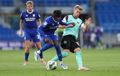 090822 - Cardiff City v Portsmouth, EFL Carabao Cup - Jaden Philogene of Cardiff City and Joe Pigott of Portsmouth compete for the ball