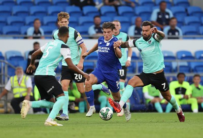 090822 - Cardiff City v Portsmouth, EFL Carabao Cup - Ollie Tanner of Cardiff City takes on Marlon Pack of Portsmouth and Haji Mnoga of Portsmouth