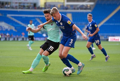 090822 - Cardiff City v Portsmouth, EFL Carabao Cup - Joel Bagan of Cardiff City holds off Owen Dale of Portsmouth