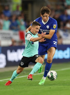 090822 - Cardiff City v Portsmouth, EFL Carabao Cup - Tom Lowery of Portsmouth  looks to hold off Rubin Colwill of Cardiff City