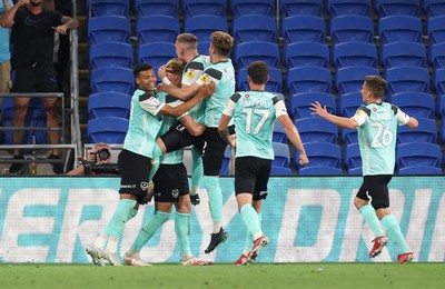 090822 - Cardiff City v Portsmouth, EFL Carabao Cup - Joe Pigott of Portsmouth celebrates with team mates after he scores the first goal of the match