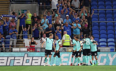 090822 - Cardiff City v Portsmouth, EFL Carabao Cup - Joe Pigott of Portsmouth celebrates with team mates after he scores the first goal of the match