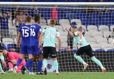 090822 - Cardiff City v Portsmouth, EFL Carabao Cup - Ronan Curtis of Portsmouth wheels away to celebrate after he scores the second goal from the penalty spot