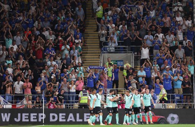 090822 - Cardiff City v Portsmouth, EFL Carabao Cup - Portsmouth players celebrate in front of their fans after scoring the third goal