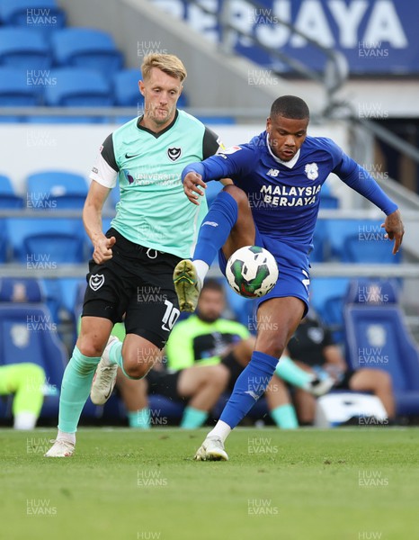 090822 - Cardiff City v Portsmouth, EFL Carabao Cup - Vontae Campbell of Cardiff City controls the ball as Joe Pigott of Portsmouth closes in