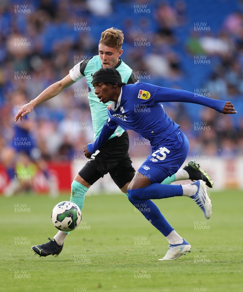 090822 - Cardiff City v Portsmouth, EFL Carabao Cup - Jaden Philogene of Cardiff City and Zak Swanson of Portsmouth compete for the ball