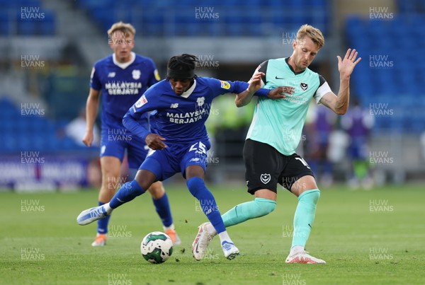 090822 - Cardiff City v Portsmouth, EFL Carabao Cup - Jaden Philogene of Cardiff City and Joe Pigott of Portsmouth compete for the ball