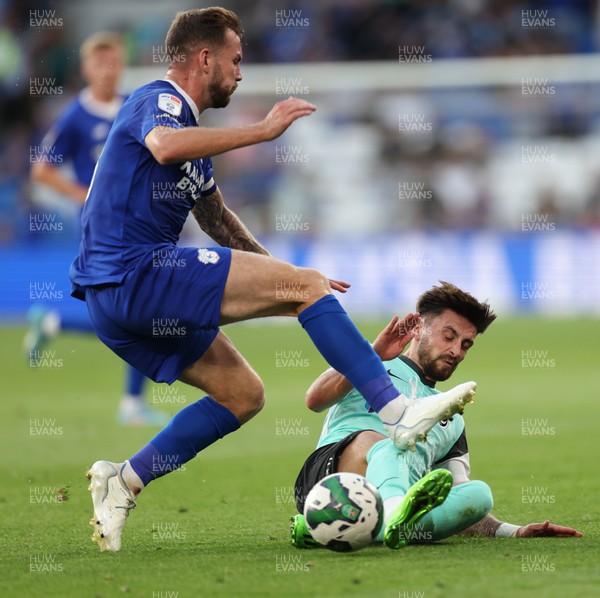090822 - Cardiff City v Portsmouth, EFL Carabao Cup - Joe Ralls of Cardiff City is tackled by Owen Dale of Portsmouth
