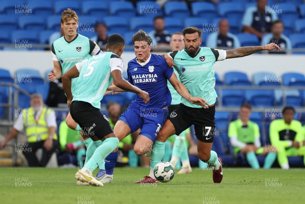 090822 - Cardiff City v Portsmouth, EFL Carabao Cup - Ollie Tanner of Cardiff City takes on Marlon Pack of Portsmouth and Haji Mnoga of Portsmouth