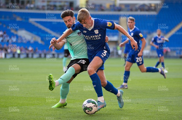 090822 - Cardiff City v Portsmouth, EFL Carabao Cup - Joel Bagan of Cardiff City holds off Owen Dale of Portsmouth