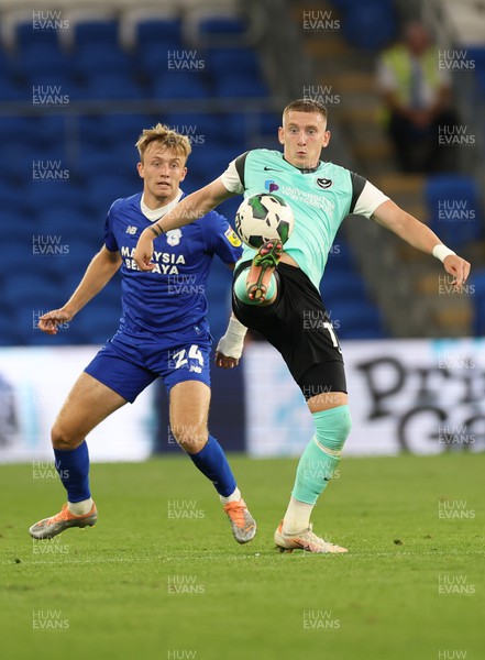 090822 - Cardiff City v Portsmouth, EFL Carabao Cup - Ronan Curtis of Portsmouth controls the ball as Eli King of Cardiff City looks on