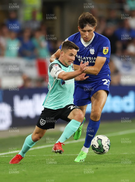 090822 - Cardiff City v Portsmouth, EFL Carabao Cup - Tom Lowery of Portsmouth  looks to hold off Rubin Colwill of Cardiff City