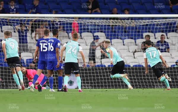 090822 - Cardiff City v Portsmouth, EFL Carabao Cup - Ronan Curtis of Portsmouth wheels away to celebrate after he scores the second goal from the penalty spot