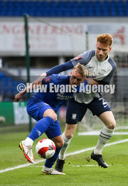 090122 - Cardiff City v Preston North End, FA Cup - Isaak Davies of Cardiff City and Sepp van den Berg of Preston North End compete for the ball